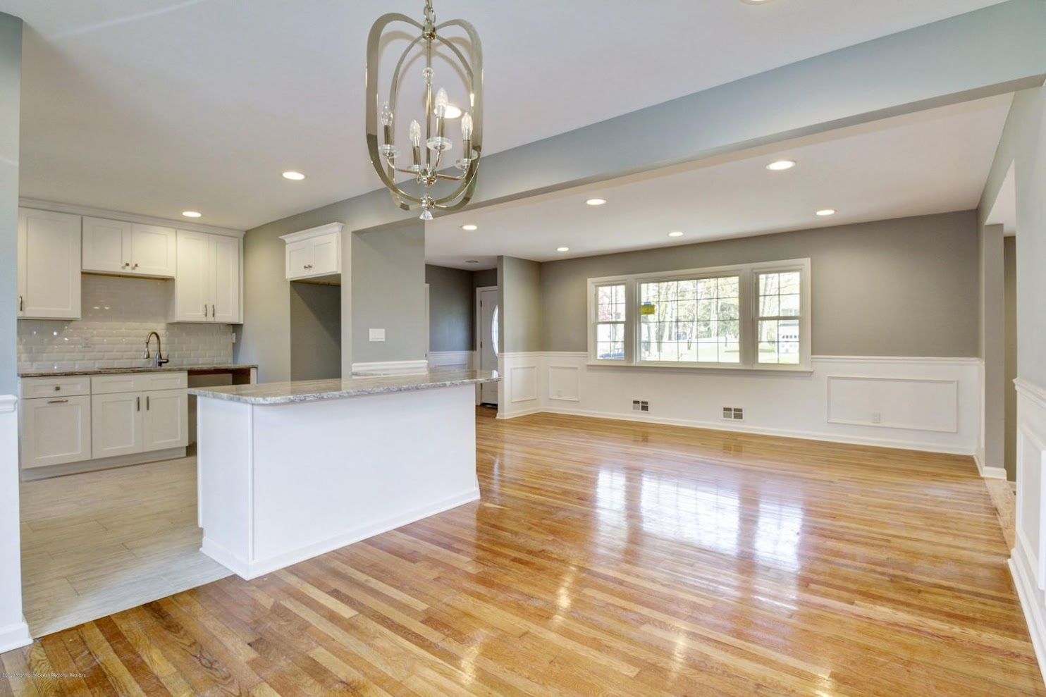 Open concept home addition with kitchen and living area